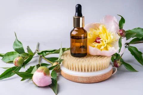 Spa set with peony flowers mortar and essential oil Stock Photos