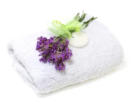 Spa set: towel, soap and  bouquet of lavender on a white background Stock Photos