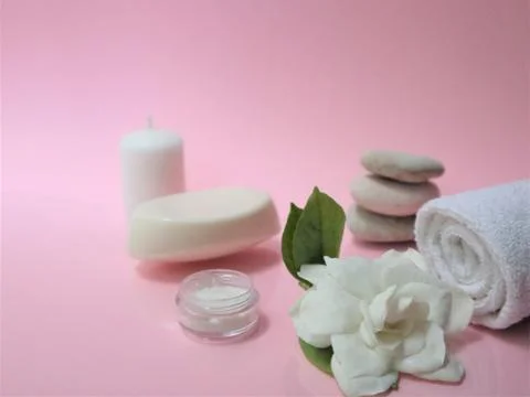 Spa setting and Spa background composition with white gardenia flower on pink Stock Photos