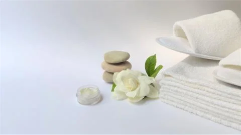 Spa setting and Spa background composition with white gardenia flower on whit Stock Photos