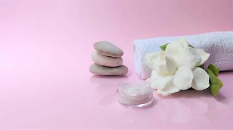 Spa setting and Spa background composition with white gardenia flower on pink Stock Photos