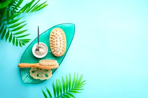 Spa setting background with cosmetic clay and massage brushes Stock Photos