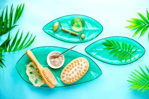Spa setting background with cosmetic clay and jade roller Stock Photos
