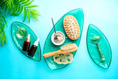 Spa setting background with cosmetic clay and jade roller Stock Photos