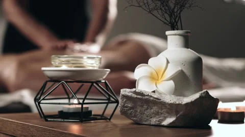 Spa setting with decorative elements, featuring a calming atmosphere, a flower, Stock Footage 323962328