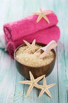 Spa setting with sea salt, soap, towel on aqua painted wooden boards. Selec.. Stock Photos