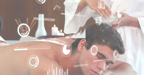 Spa therapist picking scrub and sprinkling across client back while data Stock Footage 318758680