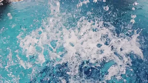 Spa thermal water dramatically splashing and swirling, creating ripples and b Stock Footage 319497881
