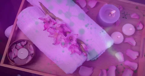 Spa tray arrangement displaying in flat design, showing rolled towels, glowing Stock Footage 308027031