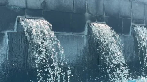 A spa waterfall flows into a small relaxation pool at a Dubai hotel's wellnes Stock Footage 313389112