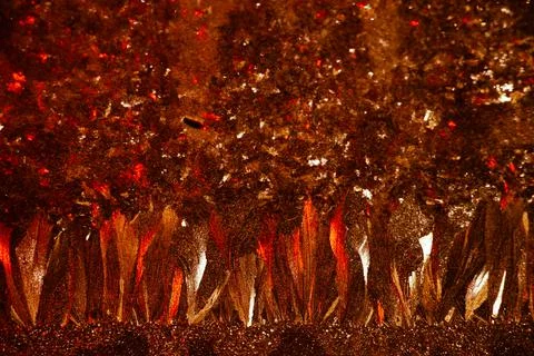 Space abstract background. Christmas backdrop. Texture of red shiny crystals. Stock Photos