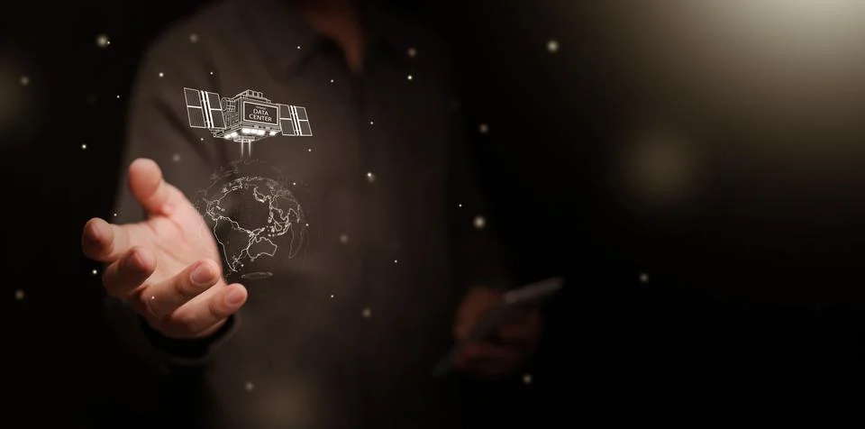 Space based data center powered by solar energy. Man hand holding satellite.. Foto stock