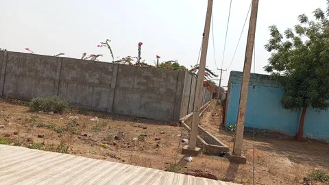 Space Between Two Building Walls With Electric Poles And Sewage Kano Nigeria Stockbeeldmateriaal 328223784