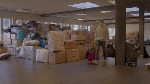 Space with boxes for collecting and sorting humanitarian aid for Ukraine. Stock Photos
