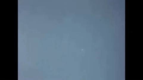 A space capsule is shown parachuting in a descent over White Sands Missile Range Video stock 93508525