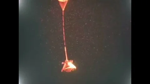 A space capsule is shown parachuting down onto White Sands Missile Range in New Stockbeeldmateriaal 93508499