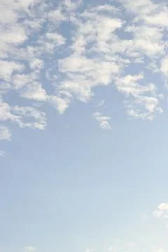 Space of clear sky with soft scattered clouds, creating a feeling of calm Stock Photos