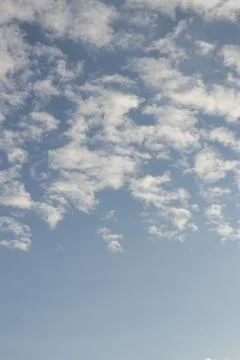 Space of clear sky with soft scattered clouds, creating a feeling of calm Stock Photos