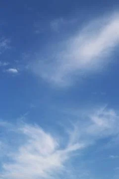 Space of clear sky with soft scattered clouds, creating a feeling of calm Stock Photos
