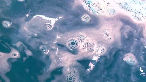 Space-colored bath bomb dissolves in water Stock Footage 138382467