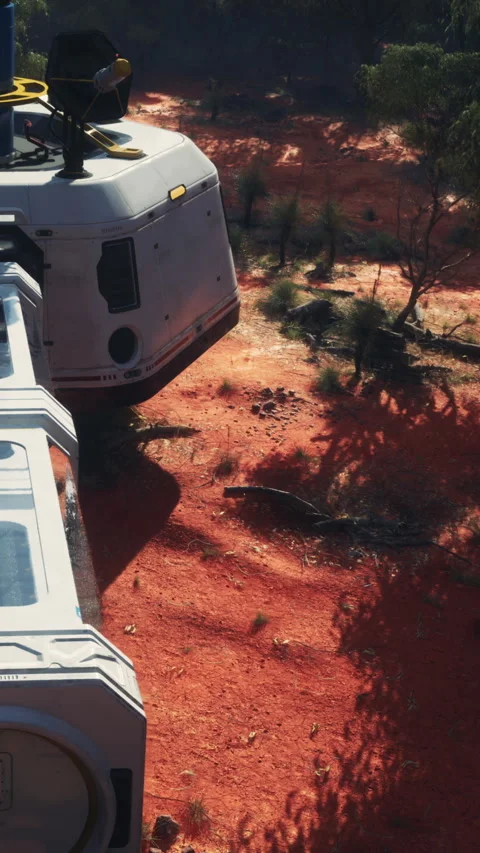 Space craft on landing platform in red desert area during daylight hours Stock Footage 343174832