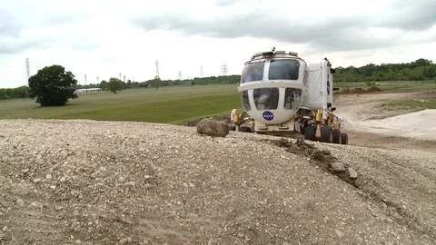 Space Exploration Vehicle moving up the slope Video stock 99085636