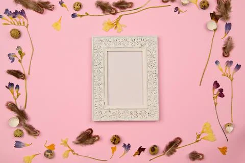 Space frame to insert on pink background with easter decor Stock Photos
