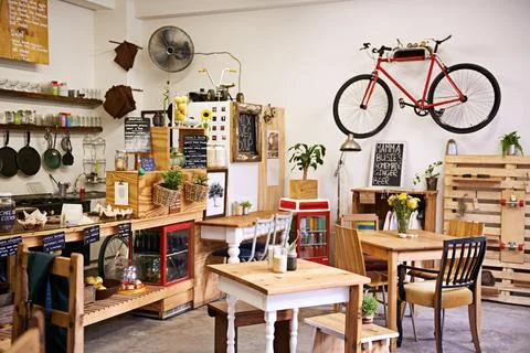 Space, interior and empty coffee shop with table, chairs and furniture or small Stock Photos