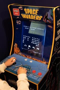 Space invaders Taito game machine. Simple Space Arcade in 8-bit retro video old Stock Photos