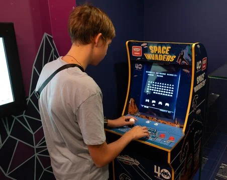 Space invaders Taito game machine. Simple Space Arcade in 8-bit retro video old Stock Photos
