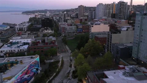 Space Needle and downtown Seattle skyline during dawn, with city streets and Stock Footage 334827123