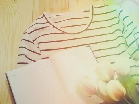 Space of notebook background and aritificial tulip flower bouquet Stockfoto's