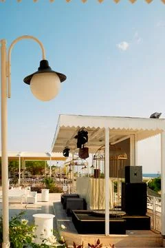 Space by the ocean with seating arranged for  event.  stage is set up with eq Foto stock