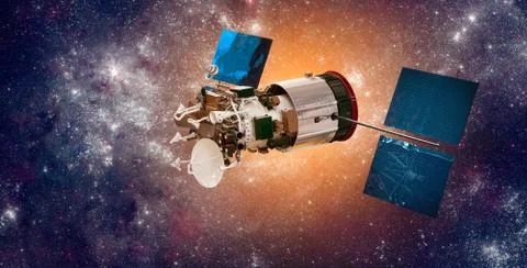 Space satellite orbiting the earth on a background star sun. 写真素材
