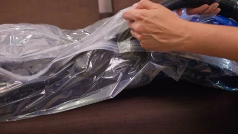 Premium Photo  Space saver saving seal bag sucking air vacuum