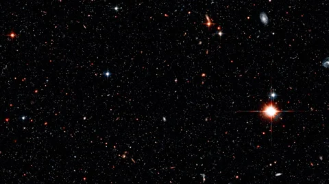 Space section with a red quasar and a spherical star congestion Video stock 47945293