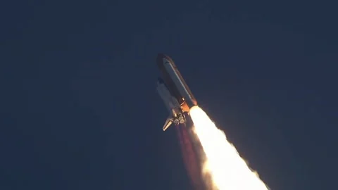 Space shuttle ascending into the sky with a massive trail of fire. Stock Footage 335858676