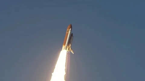 A space shuttle ascends into the sky with a powerful fire trail. Stock Footage 335858677