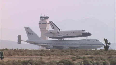 Space Shuttle Atlantis atop NASA Boeing 737 taxiing at Edwards Air Base Stock Footage 283627192