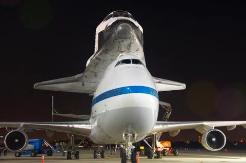 Space shuttle being transported on top of an aircraft. Stock Photos