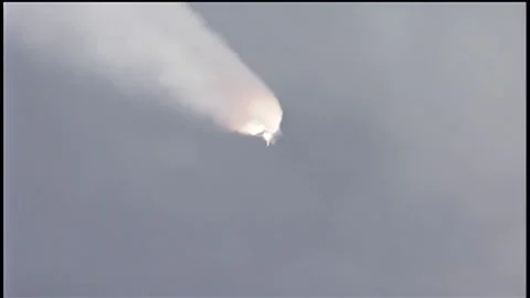 Space Shuttle flying into earth's athmopshere leaving auxiliary engines Stock Footage 313121539