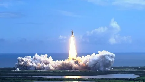 Space shuttle lifting off over water Stock Footage