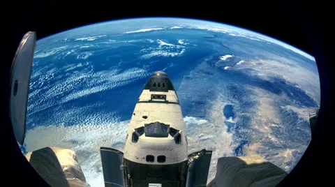 Space Shuttle Seen from International Space Station with Earth Stock-Footage 1182705
