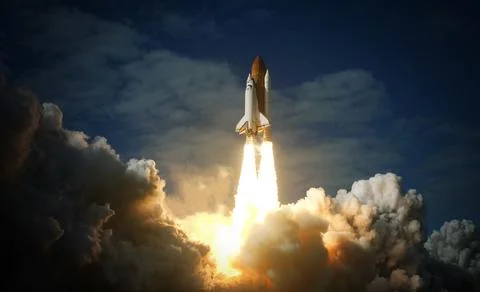 Space Shuttle takes off into space. Elements of this image furnished by NASA. Stock Photos