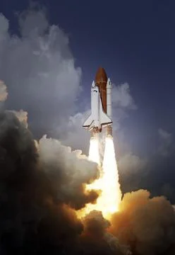 Space Shuttle takes off into space. Elements of this image furnished by NASA. Stock Photos