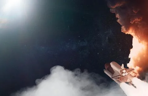 Space Shuttle takes off into space. Elements of this image furnished by NASA. Stock Photos