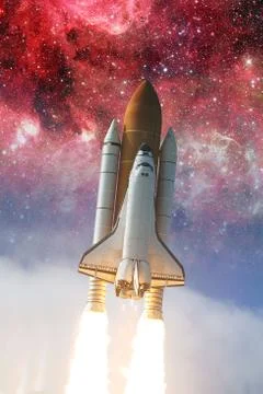 Space shuttle taking off on a mission. Elements of this image furnished by NA Stock Photos