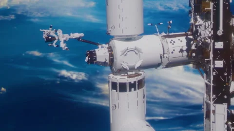 Space station activity with robotic arm in low Earth orbit Stock Footage 345055785