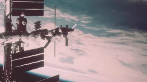 Space station seen from orbit with earth below during daylight Stock Footage 344396737
