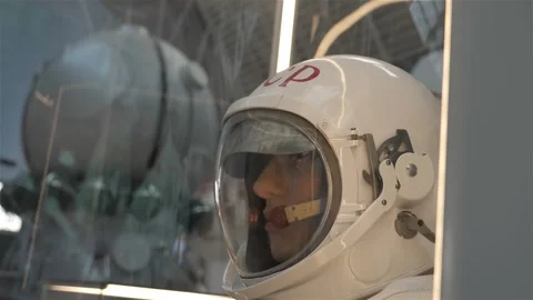 Space suit helmet close up. studies of the star system. Humanity in space Stockbeeldmateriaal 147060762